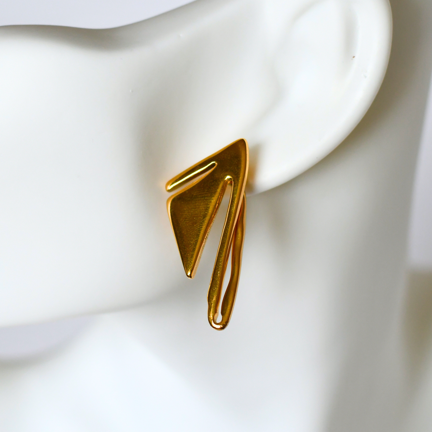 ALNEA gold stainless steel earring on ear - Alogan