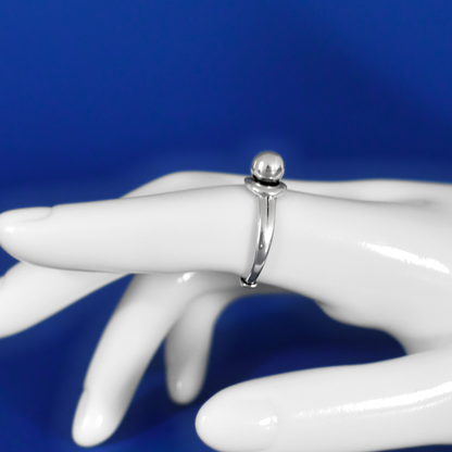 COSMO sterling silver adjustable ring with futuristic design on finger